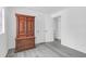 Bedroom with wood-look floors, wardrobe cabinet, white walls, and ample natural light at 1514 Patterson Ave, Charleston, SC 29412