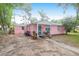Charming pink single-story home with tidy landscaping offering great curb appeal at 1514 Patterson Ave, Charleston, SC 29412