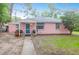 Charming single-story pink home with a welcoming front entrance and well-maintained lawn at 1514 Patterson Ave, Charleston, SC 29412