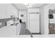 Bright kitchen with white cabinets, modern appliances, grey subway tile backsplash and pantry at 1514 Patterson Ave, Charleston, SC 29412