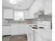 Well-lit kitchen featuring bright white cabinets, modern appliances, and updated countertops at 1514 Patterson Ave, Charleston, SC 29412