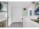 Clean laundry room featuring ample shelving and white appliances at 1514 Patterson Ave, Charleston, SC 29412