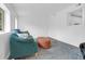 Living room featuring large windows and comfortable sofa and ottoman seating at 1514 Patterson Ave, Charleston, SC 29412