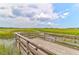 Picturesque views of marsh from wooden viewing platform on a sunny day at 1514 Patterson Ave, Charleston, SC 29412