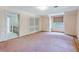Bright bedroom with pink carpet, closet, and large window providing natural light at 17 Johnson Rd, Charleston, SC 29407