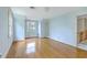 Bedroom with light blue walls, hardwood floors, large windows, and a closet at 17 Johnson Rd, Charleston, SC 29407