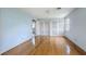 Light blue bedroom with hardwood floors, shuttered closet, and a large window at 17 Johnson Rd, Charleston, SC 29407