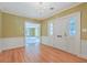 Bright foyer with hardwood floors, chandelier, and view into a large living space at 17 Johnson Rd, Charleston, SC 29407