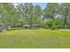 Expansive front yard with mature trees and meticulously manicured landscaping at 17 Johnson Rd, Charleston, SC 29407