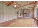 Living room with hardwood floors, fireplace, and wood paneled walls at 17 Johnson Rd, Charleston, SC 29407