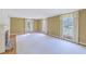 Spacious living room with large windows, fireplace, and hardwood flooring at 17 Johnson Rd, Charleston, SC 29407