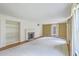 Open living room with fireplace, built-in shelving, and abundant natural light at 17 Johnson Rd, Charleston, SC 29407