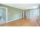 Bright main bedroom with hardwood floors and multiple windows leading to bathroom and closet at 17 Johnson Rd, Charleston, SC 29407