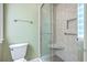 Clean shower with glass door, shower bench, and tiled walls in bathroom at 17 Johnson Rd, Charleston, SC 29407