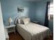 Bedroom with white wicker headboard, quilted bedding, and neutral decor at 1736 E Ashley Ave, Folly Beach, SC 29439