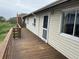 Exterior deck view featuring wood railings, stairs, and natural views at 1736 E Ashley Ave, Folly Beach, SC 29439
