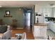 Open floor plan showcases the living room, hallway, and kitchen with hardwood floors at 1736 E Ashley Ave, Folly Beach, SC 29439