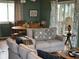 Comfortable living room with a plush sofa, a round dining table, and beachy decor at 1736 E Ashley Ave, Folly Beach, SC 29439