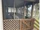 Comfortable screened porch featuring an outdoor dining table, perfect for enjoying meals and fresh air at 1736 E Ashley Ave, Folly Beach, SC 29439