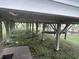 View underneath a raised home, revealing the structural support and ground below at 1736 E Ashley Ave, Folly Beach, SC 29439