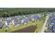 An aerial view of beautiful single-Gathering homes near a pond surrounded by lush green lawns at 1787 Timmons St, Mount Pleasant, SC 29466