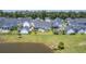 A lovely aerial perspective showcases well-kept single-Gathering houses, and a tranquil pond at 1787 Timmons St, Mount Pleasant, SC 29466