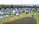 A lovely aerial perspective showcases well-kept single-Gathering houses, and a tranquil pond at 1787 Timmons St, Mount Pleasant, SC 29466