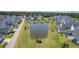 A tranquil pond surrounded by lush greenery complements the nearby lovely single-Gathering homes in this aerial scene at 1787 Timmons St, Mount Pleasant, SC 29466