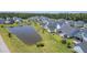Charming aerial view of single-Gathering houses next to a relaxing pond with lush green lawns at 1787 Timmons St, Mount Pleasant, SC 29466