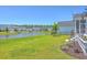 Scenic backyard view with a pond, manicured lawn, and beautifully landscaped surroundings at 1787 Timmons St, Mount Pleasant, SC 29466