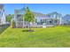 Lush backyard with water views, entertainment area, and lush lawn at 1787 Timmons St, Mount Pleasant, SC 29466