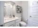 Bright bathroom featuring a white vanity, stylish shelving, and neutral wall paint at 1787 Timmons St, Mount Pleasant, SC 29466