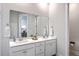 Bright bathroom features a double vanity with a large mirror and modern fixtures at 1787 Timmons St, Mount Pleasant, SC 29466