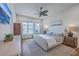Bright bedroom features a decorative ceiling fan, large windows, and a stylish upholstered bed at 1787 Timmons St, Mount Pleasant, SC 29466
