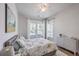 Cozy bedroom with a floral patterned comforter, two windows and a dresser at 1787 Timmons St, Mount Pleasant, SC 29466