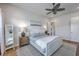 Bright bedroom with a decorative ceiling fan, a white upholstered bed, and ample natural light at 1787 Timmons St, Mount Pleasant, SC 29466