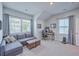 Well-lit bonus room featuring a cozy sofa, desk, and a tranquil ambiance for relaxation or work at 1787 Timmons St, Mount Pleasant, SC 29466