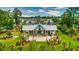 Aerial view of a community clubhouse, manicured landscaping, and outdoor seating area at 1787 Timmons St, Mount Pleasant, SC 29466