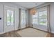 Bright dining area with access to the porch and two large windows at 1787 Timmons St, Mount Pleasant, SC 29466