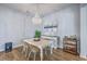 Elegant dining room with chandelier lighting, decorative artwork, and hardwood floors at 1787 Timmons St, Mount Pleasant, SC 29466
