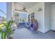 Comfortable front porch with a wicker chair, a ceiling fan, and serene outdoor living space at 1787 Timmons St, Mount Pleasant, SC 29466
