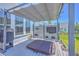 Outdoor covered entertainment area featuring hot tub, TV, and modern pergola at 1787 Timmons St, Mount Pleasant, SC 29466