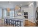 Large kitchen island with seating and stainless appliances provides modern appeal at 1787 Timmons St, Mount Pleasant, SC 29466