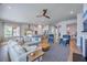 Open concept living room flows to kitchen with ample seating and natural light at 1787 Timmons St, Mount Pleasant, SC 29466