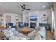 Bright living area featuring a fireplace, a large sofa, and two blue armchairs at 1787 Timmons St, Mount Pleasant, SC 29466