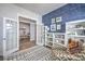 Bright office space featuring French doors, nautical wallpaper, and custom shelving at 1787 Timmons St, Mount Pleasant, SC 29466