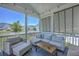 Comfortable screened porch features water views, modern furniture, and stylish decor at 1787 Timmons St, Mount Pleasant, SC 29466