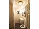 Small bathroom has a single sink vanity, toilet, and a framed mirror with overhead lighting at 1925 Kerry St, North Charleston, SC 29406