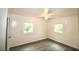 A bright, empty bedroom with wood-look flooring and white paneled walls at 1925 Kerry St, North Charleston, SC 29406