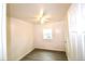 A bright, empty bedroom with wood-look flooring and white paneled walls at 1925 Kerry St, North Charleston, SC 29406